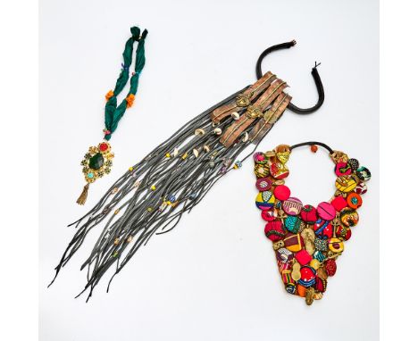 Comprising one cloth button and bronze example and a metal, leather, and glass bead example, the longest length is 27 inches 