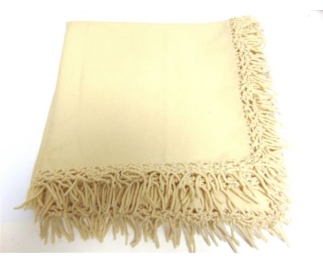 A WELSH FLANNEL NURSING SHAWL (SIOL MAGU OR SIOL NYRSID)  cream with a knotted fringe to all four sides, 190cm x 190cm; toget