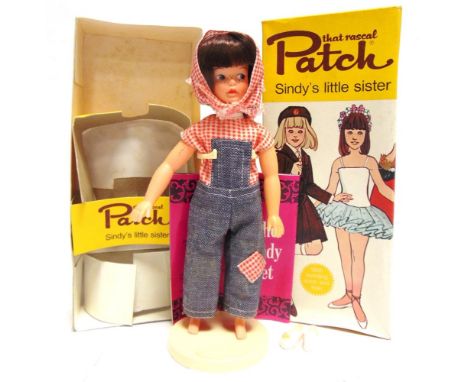 A PEDIGREE PATCH (SINDY'S LITTLE SISTER) DOLL  brunette, good condition, complete with Sindy Set display stand and leaflet, b