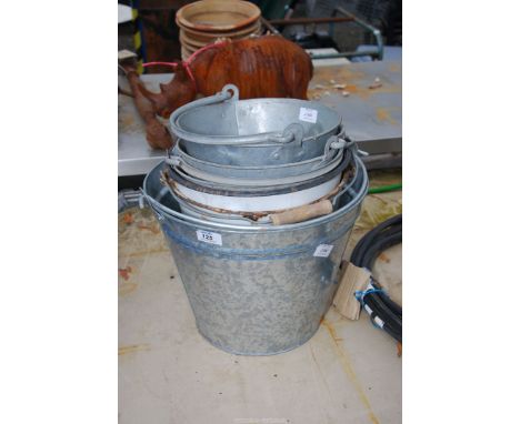A quantity of galvanised and enamel buckets.