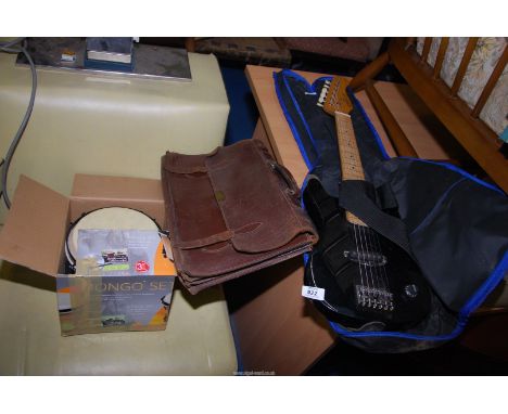 A Bongo drum, a child's small "Elevation" electric guitar and a leather music bag.