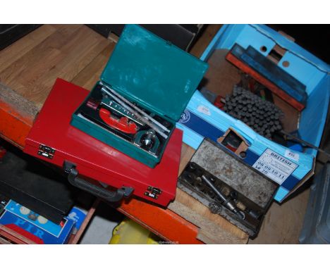 Cased steel drill bits, taps and dies, clutch alignment tool, pipe flaring kit and an impact driver.