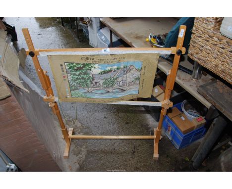 A tapestry frame with a half-finished tapestry.
