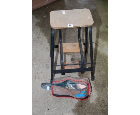 A step stool and a set of boules.