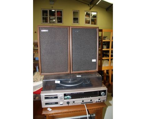 A LLoytron AM/FM stereo track radio recorder with two speakers.