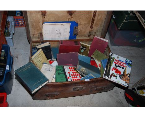 Books on Radio and Television servicing in an old leather trunk.