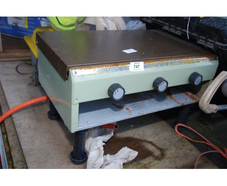 A two ring gas cooker with grill.