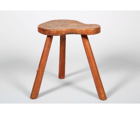 Oak stool by Robert ‘Mouseman ‘Thomson (British 1876-1955), the kidney shaped seat with carved trademark mouse on high relief