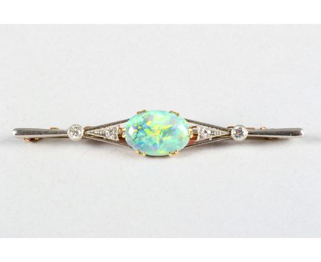 Ladies gold bar brooch, set with diamonds and a large oval opal measuring 16mm x 10mm 
