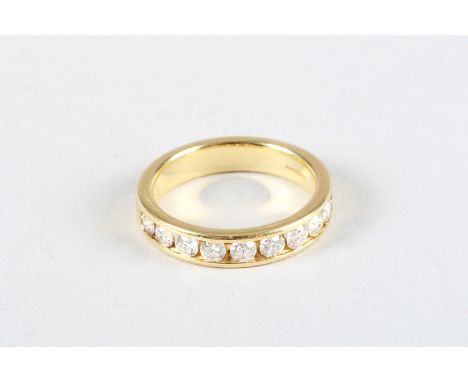 Ladies 18 carat yellow gold half diamond eternity ring, with nine set 0.1 brilliant cut diamonds 