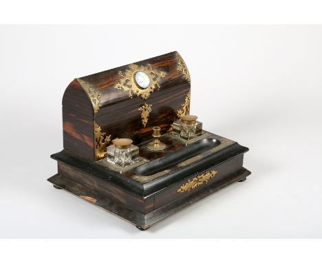 Calamander brass mounted desk stand stationary compartment mounted with circular Wedgewood plaque, over secret drawer reveali