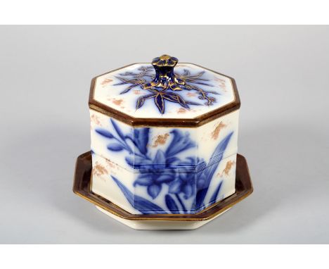 Large octagonal shaped ceramic cheese dish and cover blue and white floral decoration with gilt enrichments. 23cm high, 27cm 