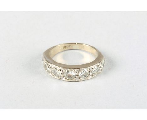 18 carat white gold half diamond eternity ring, seven graduated brilliant cut diamonds, 0.33 carat diamond flanked by 0.25 ca
