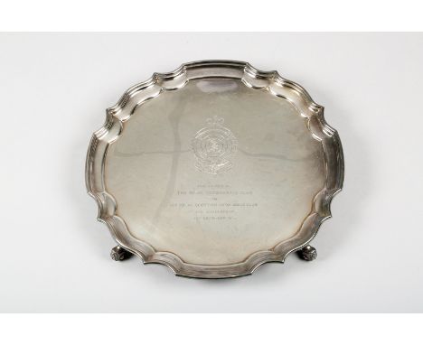 Silver presentation salver, with a pie crust edge and raised on three scroll feet, enamelled emblem of the Royal Automobile C