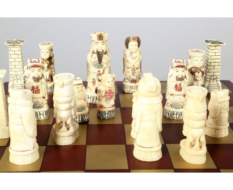 Complete carved bone/ivory chess set in original fitted lacquered box which opens to a chess games board, detailed carving to