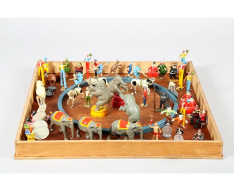 Boxed toy lead circus ring and figures, approximately 108 figures including ring master, orchestra, stilt men, animal trainer