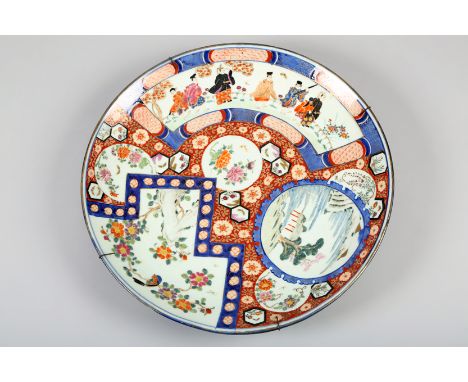 19th century Japanese ceramic charger decorated in Imari style with assorted shaped panels with figures, landscapes, flowers 