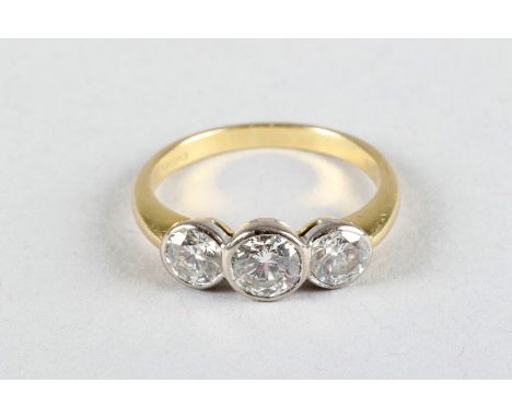 Ladies 18 carat yellow gold three stone diamond ring centre stone 0.5 carat brilliant cut diamond flanked either side by a se