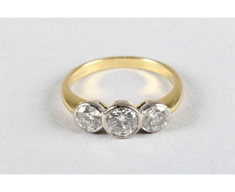 Ladies 18 carat yellow gold three stone diamond ring centre stone 0.5 carat brilliant cut diamond flanked either side by a se