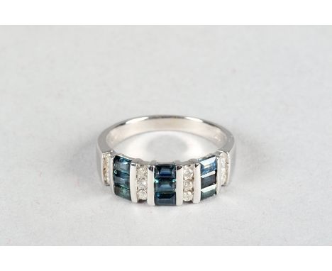 14kt white gold sapphire and diamond ring, three bands of three baggette cut sapphires interspaced between bands of three bri