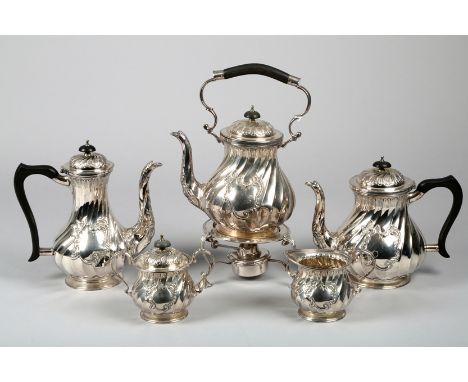 Silver five piece tea and coffee service, assay marked Sheffield 1976, spiral fluted form with S shaped spouts and ebonised h