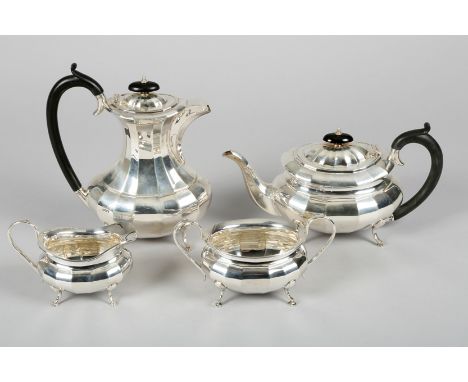Silver four piece tea and coffee service, assay marked London 1933, Emile Viner, faceted form ebonised handles raised on pad 