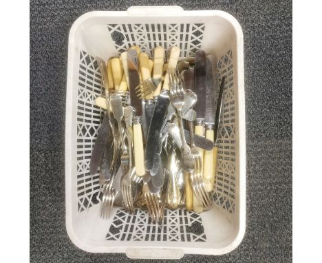 A basket of mixed cutlery.