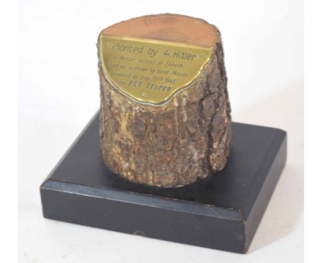 Paperweight comprising a tree trunk mounted on metal plaque inscribed "tree planted by Adolf Hitler in Wetzer District in Ein