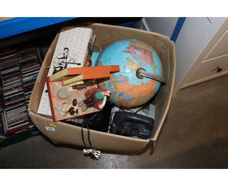 A box containing various sundry items to include a Wallace and Gromit radio, GeoSafari globe, an Elvis Sings teddy bear etc.