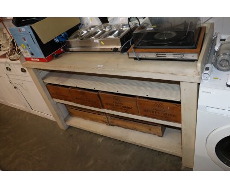 A painted kitchen bench with wine box storage