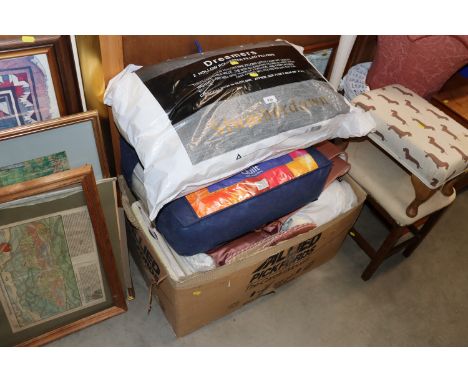 A box of various curtains and bedding