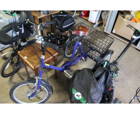 A Pashley Picador tricycle with rear view mirror; five speed gears; Brooks bicycle saddle; rear basket with front and rear mu