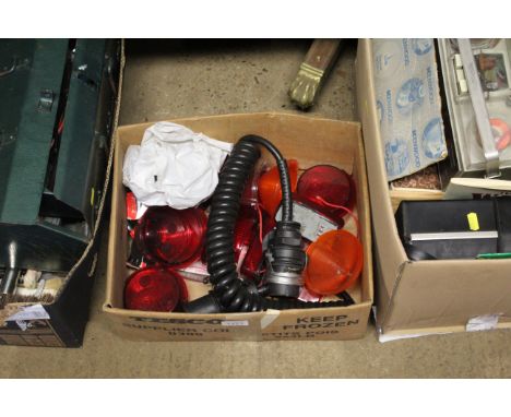 A quantity of plastic break light covers and a trailer wiring loom