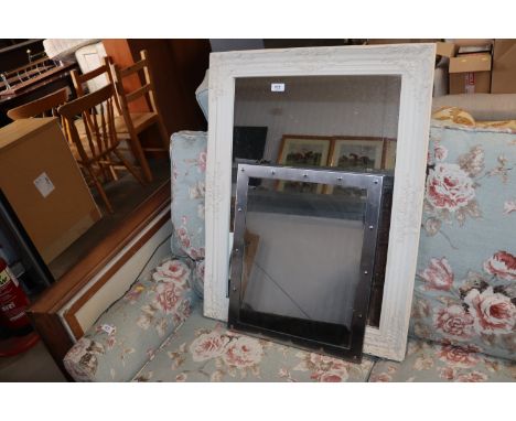 A modern metal framed mirror; and an ornate framed wall mirror