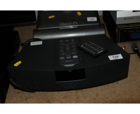 A Bose Wave radio and remote control