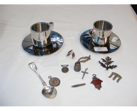 A pair of Georg Jensen of Denmark Espresso cups and saucers, together with assorted silver trinkets 