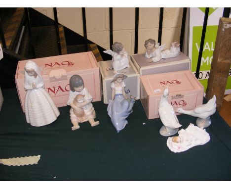 A selection of Lladro and Nao figures, some boxed