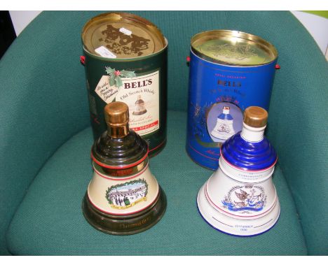 An unopened Bell's Scotch Whisky decanter in original tin, together with one other 