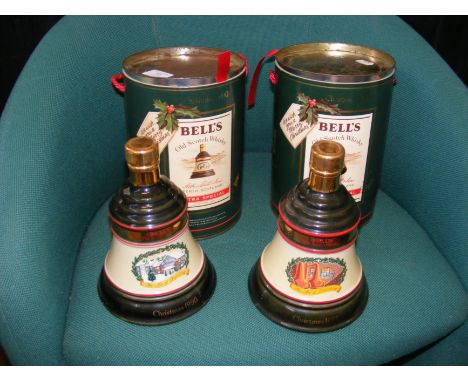 An unopened Bell's Scotch Whisky decanter in original tin, together with one other 