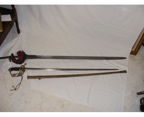 An antique Continental sword - 120cms long, together with a British military sword with metal scabbard - 102cms long CONDITIO
