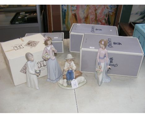 Three Lladro figurines and a Nao figurine