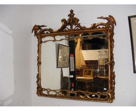 A Chippendale style antique gilt wall mirror with Chinese man and phoenix mount to the top - 98cm x 100cm CONDITION REPORT In