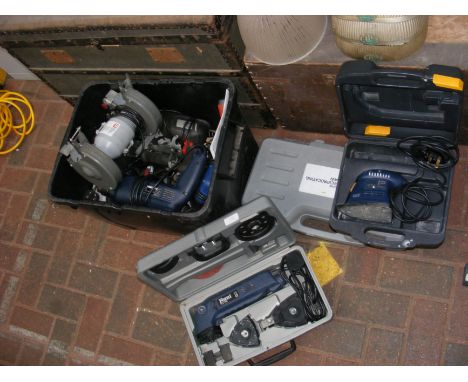 A quantity of electric power tools including Performance bench grinder and hammer drills