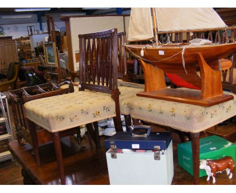 A set of four antique dining chairs with tapestry seats and reeded support