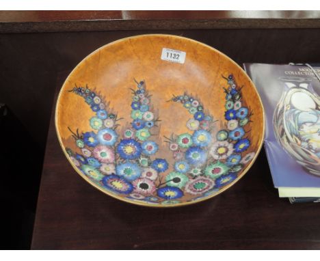 A Carltonware dish having lupin floral decoration on orange mottled ground