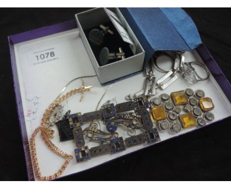 A selection of costume jewellery including slate cufflinks, vintage buckles, jet Mizpah pendant, earrings, rings, gilt bracel