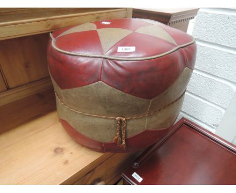 A vintage leatherette pouffe 