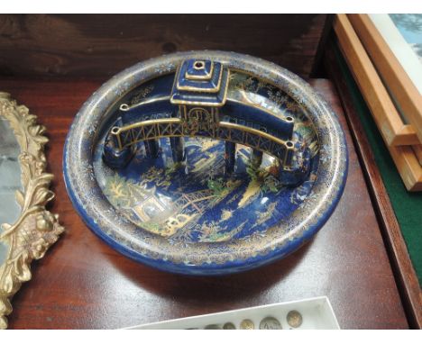 A Carltonware dish in gilt heightened blue royale Japanesque design and a matching Pagoda bridge ornament 