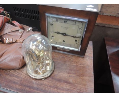 A 1940s mantel clock, Goldsmiths and Silversmiths Company London, with presentation label ICI and a vintage dome clock