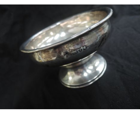 A small Victorian silver trinket bowl of plain circular form, Chester 1899, makers mark worn